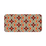 Infidu desk pad with an ornate floral pattern in orange, red, and cream on a light cream background, adding elegance to your workspace. Desk Pad kept on a plain white background