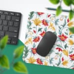 White desk mat with a large floral pattern featuring red, yellow, and blue flowers, and green leaves, adding a vibrant touch to your desk. Desk Pad with Keyboard and Mouse