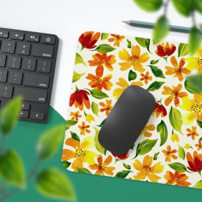 White desk mat with an autumn-themed floral pattern, featuring stylized leaves and flowers in orange, yellow, and green tones. Desk Pad with Keyboard and Mouse