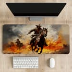 Desk pad with a rider on a brown horse amidst a fiery background with orange and yellow flames. desk pad kept on the table