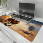 Dynamic brown horse galloping with flowing mane against a blue sky background. the desk pad is kept on the laptop