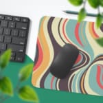 Infidu Geometric Pattern Art Desk Pad with swirling, pastel wave patterns in yellow, green, pink, and blue. Desk Pad with Keyboard and Mouse