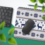 Infidu Desk Pad with white background, featuring blue and yellow reindeer, snowflakes, and geometric shapes in a knitted pattern. Desk Pad with Keyboard and Mouse