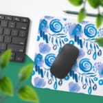 Infidu Desk Pad with blue raindrop or leaf-like brush stroke patterns on a white background, creating a calm and refreshing design. Desk Pad with Keyboard and Mouse