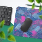 Infidu Desk Pad with blue and pink brush strokes blending, creating a dreamy and artistic effect on a light background. Desk Pad with Keyboard and Mouse