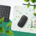 Infidu desk mat featuring a whimsical elephant and giraffe on a scooter, perfect for adding fun to any workspace Desk Pad on the Mouse