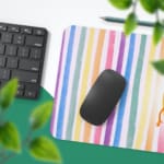 Infidu Crayon Cartoon Desk Mat with colorful vertical stripes and a cheerful cartoon pencil character, adding a creative touch to your desk. Desk Pad with Keyboard and Mouse