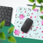 Light mint green desk mat with large pink roses and green leaves, offering a unique and charming touch to your workspace. Desk Pad with Keyboard and Mouse