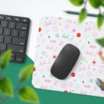 Infidu Running Boy Desk Mat with a white background, pink and green designs, and a cartoon boy running with a backpack, adding a playful touch. Desk Pad with Keyboard and Mouse