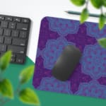 Infidu Desk Pad with a deep purple background and light blue floral or snowflake pattern, adding elegance and style to your workspace.