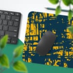 Infidu Vector Pattern Desk Pad with yellow grid-like lines on a deep teal background, ideal for modern workspaces. Desk Pad with Keyboard and Mouse