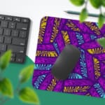 Infidu Vector Pattern Desk Pad with pink and blue leaf-like shapes on a deep purple background, perfect for modern workspaces. Desk Pad with Keyboard and Mouse