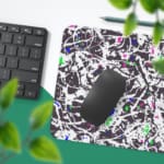 Infidu Vector Pattern Desk Pad with chaotic black and white design, colorful accents, and a white background. Desk Pad with Keyboard and Mouse