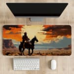 Silhouette of a rider on a horse with a sunset background, featuring dramatic orange and red clouds against a desert-like landscape. desk pad kept on the table