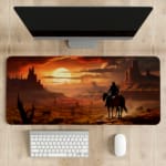 Rider on horseback in a desert with towering rock formations and a warm, colorful sunset sky. desk pad kept on the table