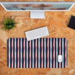 Infidu Geometric Pattern Art Desk Pad with vertical stripes in red, white, and blue for a classic and patriotic look. Desk Pad with Keyboard and Mouse in orange background