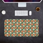 Infidu Geometric Pattern Art Desk Pad with a retro diamond-shaped pattern in orange and teal for a stylish and symmetrical workspace. Desk Pad with Keyboard and Mouse in gray background