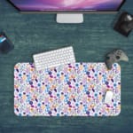 White desk mat with a small, colorful floral pattern featuring purple, pink, and orange flowers with leaves, adding vibrancy to your workspace. Desk Mat with a computer