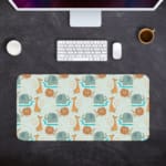 INFIDU desk mat featuring a playful lion and giraffe design on a light green background, perfect for kids’ studying, drawing, or gaming Desk Pad with Kept on a computer table