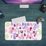 Infidu Alphabet Desk Pad with a white background featuring colorful letters and star shapes in various styles and colors. Desk Pad with Keyboard and Mouse in green background