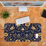 Navy blue desk mat with a golden floral pattern featuring stylized flowers and stems, adding elegance to your workspace. Desk Pad with Keyboard and Mouse in orange background