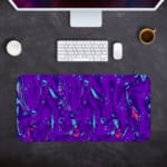 Infidu Vector Pattern Desk Pad with a swirling fluid pattern in purple and light blue on a deep purple background. Desk Pad kept on a plain gray background