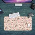 Infidu Boho Pattern Desk Mat with a colorful pattern of abstract shapes and lines in pink, blue, and green. Desk Pad kept on a green background