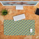 Infidu Geometric Pattern Art Desk Pad with a small, repeating pattern of blue and yellow shapes for a lively and playful look. Desk Pad with Keyboard and Mouse in orange background