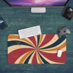 Infidu Flashback Design Desk Pad with a sunburst pattern in red, orange, brown, and blue for a retro, vintage look. Desk Pad with Keyboard and Mouse in green background