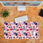 Infidu Desk Pad with colorful watercolor-like dots in shades of purple, red, and pink, creating a bright and artistic design. Desk Pad with Keyboard and Mouse in orange background