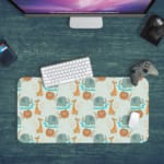 INFIDU desk mat featuring a playful lion and giraffe design on a light green background, perfect for kids’ studying, drawing, or gaming Desk Pad in computer table with green background