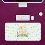 Infidu desk mat featuring a whimsical elephant and giraffe on a scooter, perfect for adding fun to any workspace Desk Pad kept on a violet background