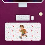 Infidu Running Boy Desk Mat with a white background, pink and green designs, and a cartoon boy running with a backpack, adding a playful touch. Desk Pad with Keyboard and Mouse in pink background