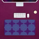 Infidu Desk Pad with a deep purple background and light blue floral or snowflake pattern, adding elegance and style to your workspace. Desk Mat with a Computer