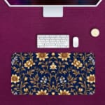 Navy blue desk mat with a golden floral pattern featuring stylized flowers and stems, adding elegance to your workspace. Desk Pad on the computer table