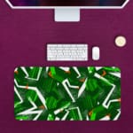 Infidu Desk Pad features green geometric patterns on a dark background, adding a stylish and durable touch to any workspace. Desk Pad with Keyboard and Mouse in pink background