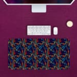 Infidu Vector Pattern Desk Pad with colorful geometric lines on a navy blue background, perfect for modern workspaces. Desk Pad Design Kept on a computer table