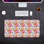 Light pink desk mat with a vibrant floral pattern featuring pink, red, and yellow flowers and blue leaves for a creative workspace touch. Desk Pad with Keyboard and Mouse