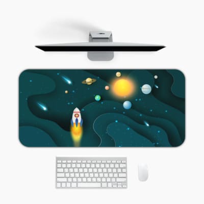 Infidu Space Desk Pad featuring a rocket launch, planets, and stars on a dark teal background. Desk Mat with a computer