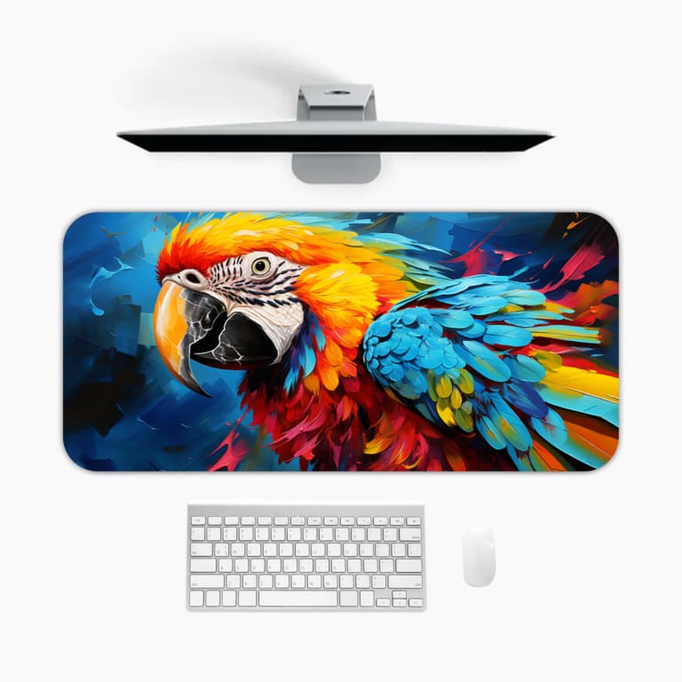 A bright parrot with vibrant feathers against a dynamic blue background. A desk pad under the computer