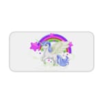 Unicorn Desk Mat with white background, rainbow, and purple stars, and a unicorn with a greenhorn surrounded by clouds. Desk Pad kept on a plain white background