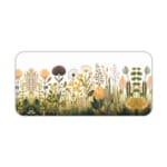 Beige desk mat with wildflowers and plants in yellow, orange, and green, featuring a creative design by digital artists. Desk Pad kept on a plain white background