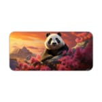 Cute panda on a rock surrounded by pink flowers and a sunset sky with orange, pink, and purple hues. Desk Pad kept on a plain white background