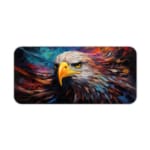 Close-up of an eagle's head with vibrant feathers and a colorful background. Desk Pad kept on a plain white background