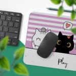 Infidu Bring Cat Magic Desk Mat featuring an anime cat in orange, white, gray, and black, with a violet and white shadow background. Perfect for kids’ desks. Desk Pad with Keyboard and Mouse