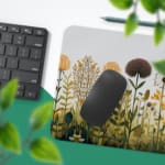 Beige desk mat with wildflowers and plants in yellow, orange, and green, featuring a creative design by digital artists. Desk Pad with Keyboard and Mouse