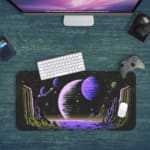 Infidu Space Desk Pad features an abstract alien landscape with geometric rock formations and multiple planets against a black space background. Desk Pad kept on a green background