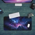 Infidu Space Desk Pad features a nebula with rich purples, blues, and pinks, set against a field of stars and cosmic clouds. Desk Pad with Keyboard and Mouse in green background