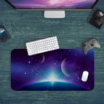 Infidu Space Desk Pad features a nebula with rich purples, blues, and pinks, set against a field of stars and cosmic clouds. Desk Pad kept on a green background