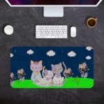 Infidu Bring Cat Magic Desk Mat featuring anime cats with a navy blue sky, clouds, and floral designs. Perfect for adding charm to any desk. Desk Pad kept on a plain gray background